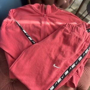 Nike Women's Red Tracksuit Set with Black Logo Trim